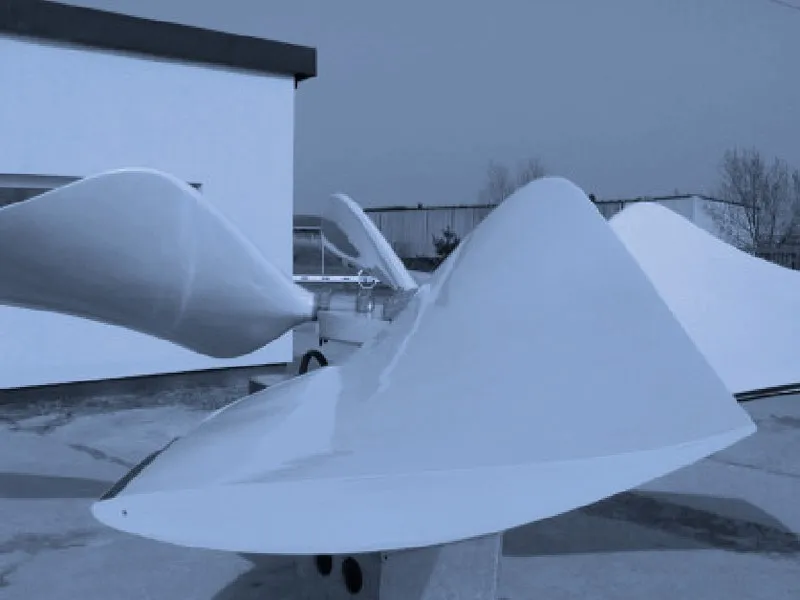 Wide white FRP blades of an assembled cooling tower fan impeller
