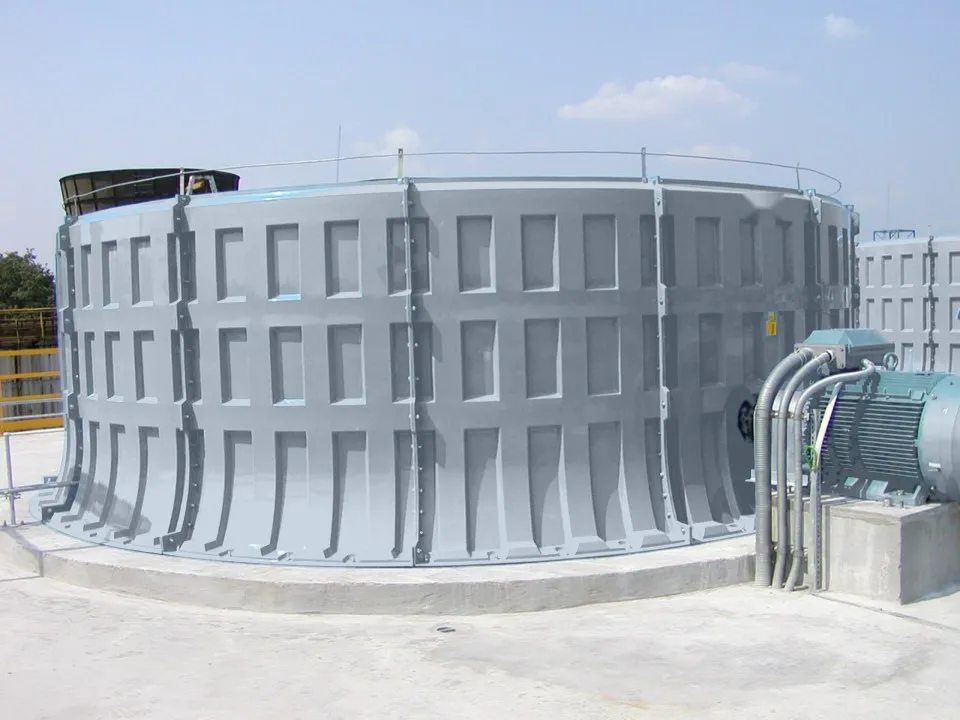 Complete cooling tower fan unit: blue FRP fan stack with the electric motor and drive alongside