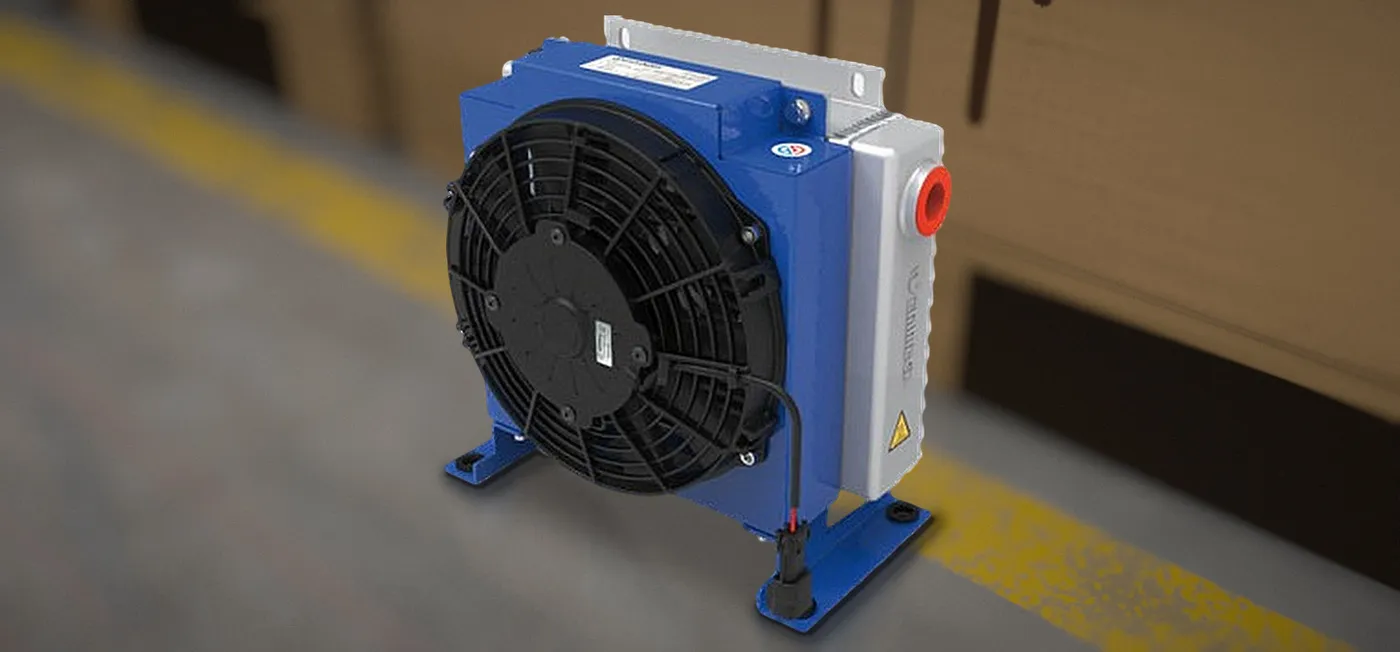 Close-up of a water-oil heat exchanger with control box and oil filter