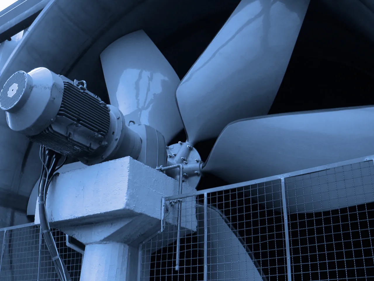 Large FRP fan blades and drive equipment inside an industrial fan stack
