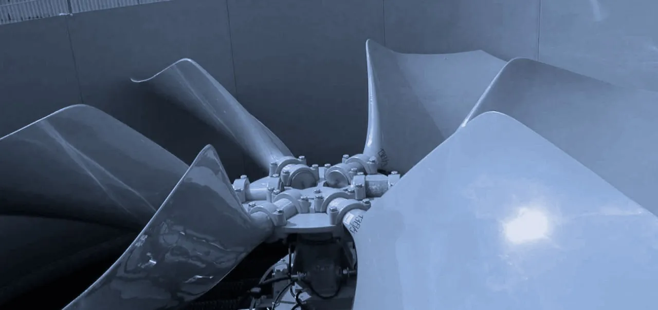 Large FRP fan blades and drive equipment inside an industrial fan stack