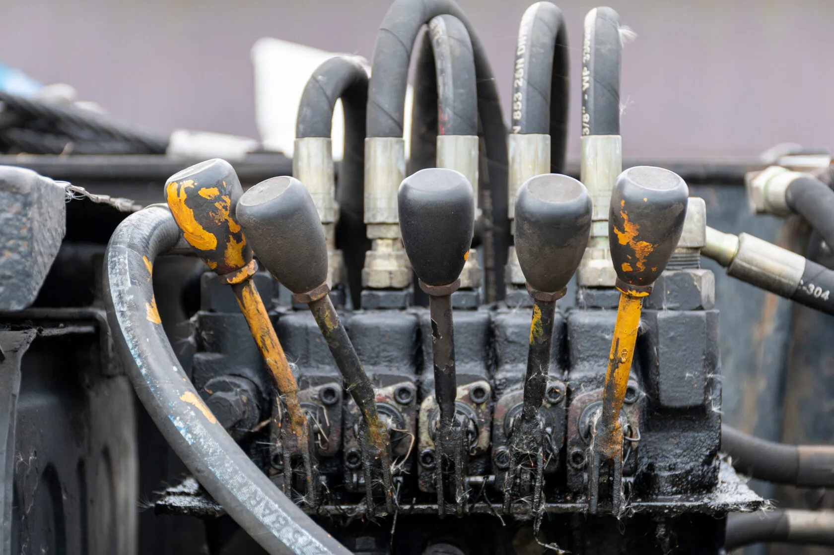 Hydraulic control valve bank with hoses and operating levers